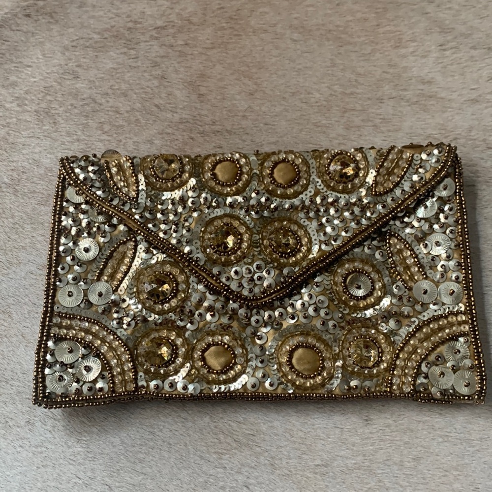Gold beaded clutch with snap closure